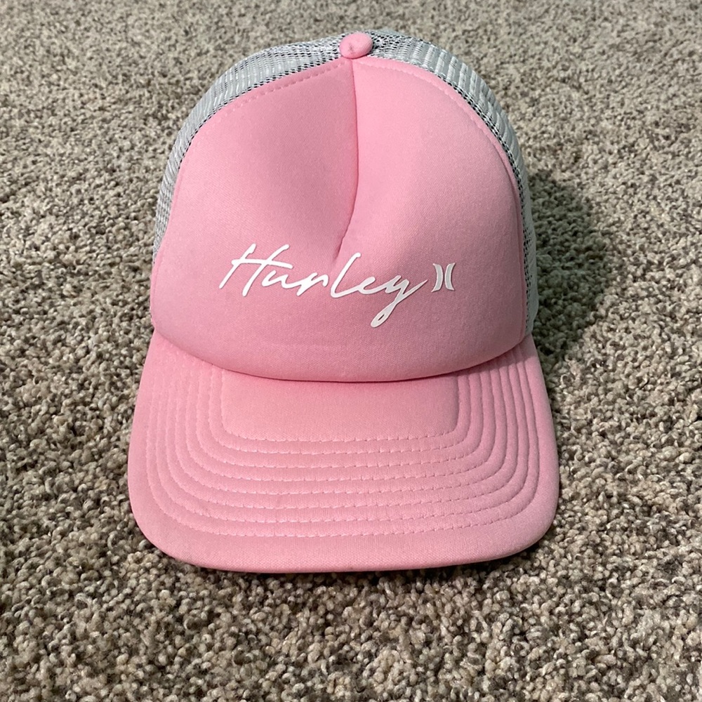 pink Hurley adjustable snap back hat with a mesh back. small stain on the bottom